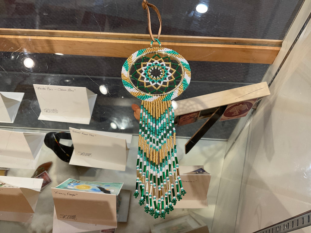 Green and gold beaded dream catcher